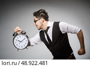 Businessman with clock in time concept. Стоковое фото, агентство Ingram Publishing / Фотобанк Лори