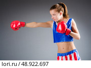 Woman boxer in uniform with US symbols. Стоковое фото, агентство Ingram Publishing / Фотобанк Лори