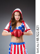 Woman boxer in uniform with US symbols. Стоковое фото, агентство Ingram Publishing / Фотобанк Лори