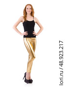 Young redhead girl in tight leggings. Стоковое фото, агентство Ingram Publishing / Фотобанк Лори