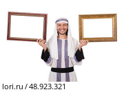 Young arab with picture frame on white. Стоковое фото, агентство Ingram Publishing / Фотобанк Лори