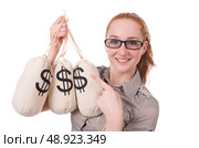 Young businesswoman with money sacks on white. Стоковое фото, агентство Ingram Publishing / Фотобанк Лори