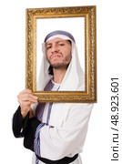 Young arab with picture frame on white. Стоковое фото, агентство Ingram Publishing / Фотобанк Лори