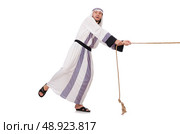 Arab man in tug of war concept. Стоковое фото, агентство Ingram Publishing / Фотобанк Лори
