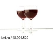Two wine glasses on the white background. Стоковое фото, агентство Ingram Publishing / Фотобанк Лори