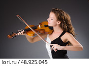 Woman artist with violin in music concept. Стоковое фото, агентство Ingram Publishing / Фотобанк Лори