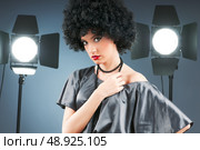 Young attractive girl with afro curly haircut. Стоковое фото, агентство Ingram Publishing / Фотобанк Лори