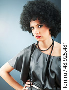 Young attractive girl with afro curly haircut. Стоковое фото, агентство Ingram Publishing / Фотобанк Лори