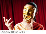 Actor with maks in a funny theater concept. Стоковое фото, агентство Ingram Publishing / Фотобанк Лори