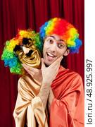 Actor with maks in a funny theater concept. Стоковое фото, агентство Ingram Publishing / Фотобанк Лори