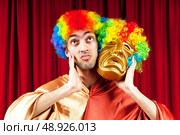 Actor with maks in a funny theater concept. Стоковое фото, агентство Ingram Publishing / Фотобанк Лори