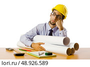 Engineer working with drawings on white. Стоковое фото, агентство Ingram Publishing / Фотобанк Лори