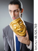 Industrial espionate concept with masked businessman. Стоковое фото, агентство Ingram Publishing / Фотобанк Лори