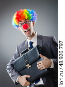 Clown businessman in funny business concept. Стоковое фото, агентство Ingram Publishing / Фотобанк Лори