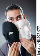 Industrial espionate concept with masked businessman. Стоковое фото, агентство Ingram Publishing / Фотобанк Лори