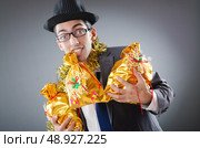 Businessman with sacks of presents. Стоковое фото, агентство Ingram Publishing / Фотобанк Лори