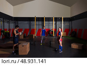 gym people group workout barbells slam balls and jump exercises. Стоковое фото, агентство Ingram Publishing / Фотобанк Лори