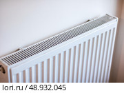 A Modern White Radiator can significantly enhance the efficiency of home heating systems. Стоковое фото, фотограф Аксенова Вера / Фотобанк Лори
