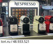 Nespresso machines and capsules display in Spanish electronics store. Редакционное фото, фотограф Данил Руденко / Фотобанк Лори