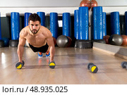 Dumbbells push-ups pushups beard man at fitness gym workout. Стоковое фото, агентство Ingram Publishing / Фотобанк Лори