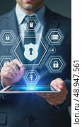 A person in a business suit working on a tablet with virtual icons related to data security, featuring a shield and locks glowing in augmented reality desktop. Стоковое AI-видео, аниматор Sergey Grishin / Фотобанк Лори