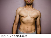 Shirtless athletic young man. Стоковое фото, агентство Ingram Publishing / Фотобанк Лори