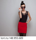 Girl in formal suit and round sunglases. Стоковое фото, агентство Ingram Publishing / Фотобанк Лори