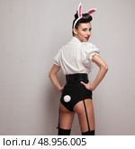 Pinup styling girl posing in vintage bunny costume. Стоковое фото, агентство Ingram Publishing / Фотобанк Лори