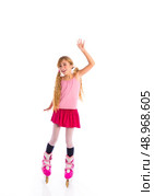 blond pigtails roller skate girl full length on white background. Стоковое фото, агентство Ingram Publishing / Фотобанк Лори