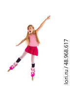 blond pigtails roller skate girl full length dancing balance on white background. Стоковое фото, агентство Ingram Publishing / Фотобанк Лори