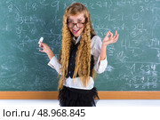 Clever nerd pupil blond girl in green board student happy schoolgirl. Стоковое фото, агентство Ingram Publishing / Фотобанк Лори