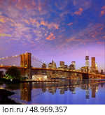 Brooklyn Bridge sunset New York Manhattan skyline NY NYC USA. Стоковое фото, агентство Ingram Publishing / Фотобанк Лори