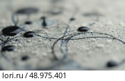 Close-up of abstract lines and patterns on a textured surface. The image features a mix of light and dark shades, creating a visually intriguing design. Стоковое AI-видео, аниматор Ольга Невская / Фотобанк Лори