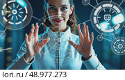 A person in a futuristic suit interacting with holographic tech elements, including digital icons and interfaces, front view, bright hi-tech background. Стоковое AI-видео, аниматор Sergey Grishin / Фотобанк Лори