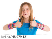 Loom rubber bands bracelets blond kid girl OK thumbs fingers gesture on white. Стоковое фото, агентство Ingram Publishing / Фотобанк Лори