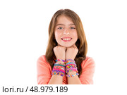 Loom rubber bands bracelets blond kid girl smiling hands in neck on white background. Стоковое фото, агентство Ingram Publishing / Фотобанк Лори