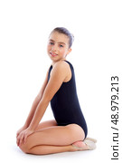 Kid girl rhythmic gymnastics exercises on white background. Стоковое фото, агентство Ingram Publishing / Фотобанк Лори