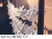 Paper prayers outside a  temple in Japan. Стоковое фото, агентство Ingram Publishing / Фотобанк Лори