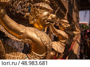 Garuda statues in the Royal Palace of Wat Phra Kaew in Bangkok Thailand. Стоковое фото, агентство Ingram Publishing / Фотобанк Лори