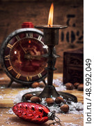 set foto burning Christmas candle in  brass candlesticks. Стоковое фото, агентство Ingram Publishing / Фотобанк Лори