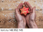 set foto Christmas toys in the human handprints. Стоковое фото, агентство Ingram Publishing / Фотобанк Лори