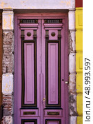 a black violet wood old door in the centre of la boca buenos aires argentina. Стоковое фото, агентство Ingram Publishing / Фотобанк Лори