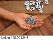 Ipe decking deck wood installation screws clips and fasteners. Стоковое фото, агентство Ingram Publishing / Фотобанк Лори