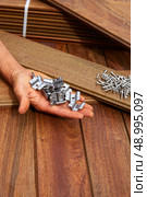 Ipe decking deck wood installation screws clips and fasteners. Стоковое фото, агентство Ingram Publishing / Фотобанк Лори