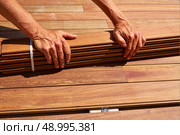 Ipe teak decking deck wood installation clips fasteners. Стоковое фото, агентство Ingram Publishing / Фотобанк Лори