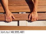 Ipe teak decking deck wood installation clips fasteners. Стоковое фото, агентство Ingram Publishing / Фотобанк Лори