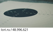 Close-up of a shooting range target sheet for practice and accuracy. Стоковое видео, видеограф Igor Tichonow / Фотобанк Лори
