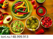 Mexican food mixed guacamole nachos chili sauce dipping cheddar cheese lemon pico de gallo. Стоковое фото, агентство Ingram Publishing / Фотобанк Лори