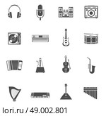 Musical Instruments Icons Set . Musical Instruments and tunes black white icons set with violin guitar and stereo system flat isolated vector illustration . Стоковая иллюстрация, агентство Ingram Publishing / Фотобанк Лори