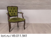 Green chair in victorian design on wooden floor. Стоковое фото, агентство Ingram Publishing / Фотобанк Лори